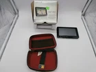 Garmin Nuvi 1490T Gps Navigator With Portable Bundle, Looks New Used. Price: $38.85.